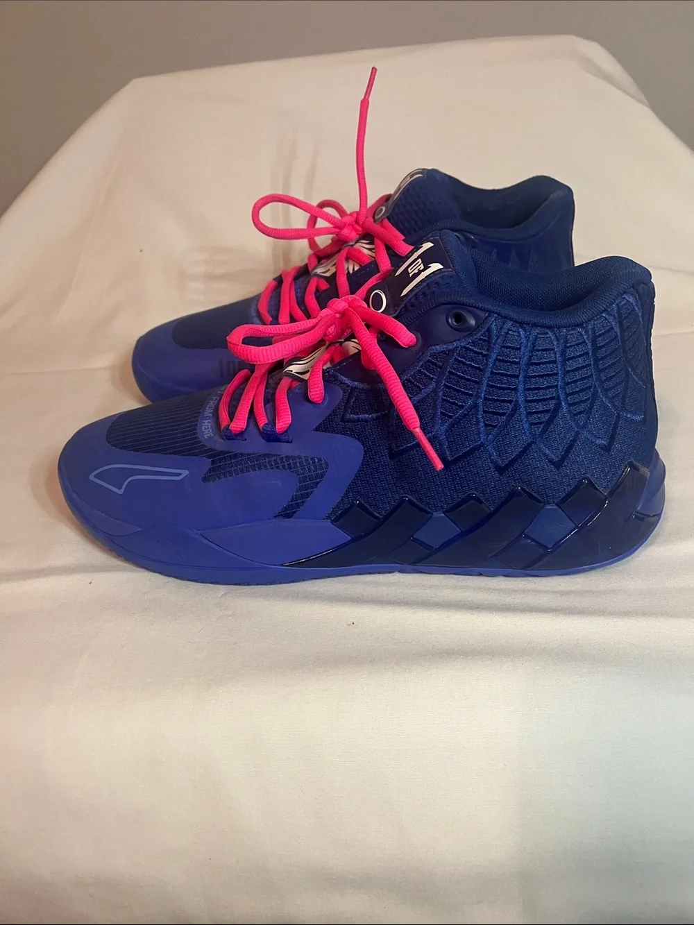 Puma mens Melo Athletic Shoes in Blue with Pink Laces